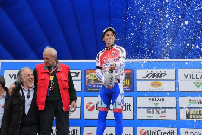 Race leader Fabio Felline (Androni Giocattoli) uncorks the bubbly