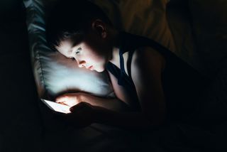 Child browsing internet on smartphone