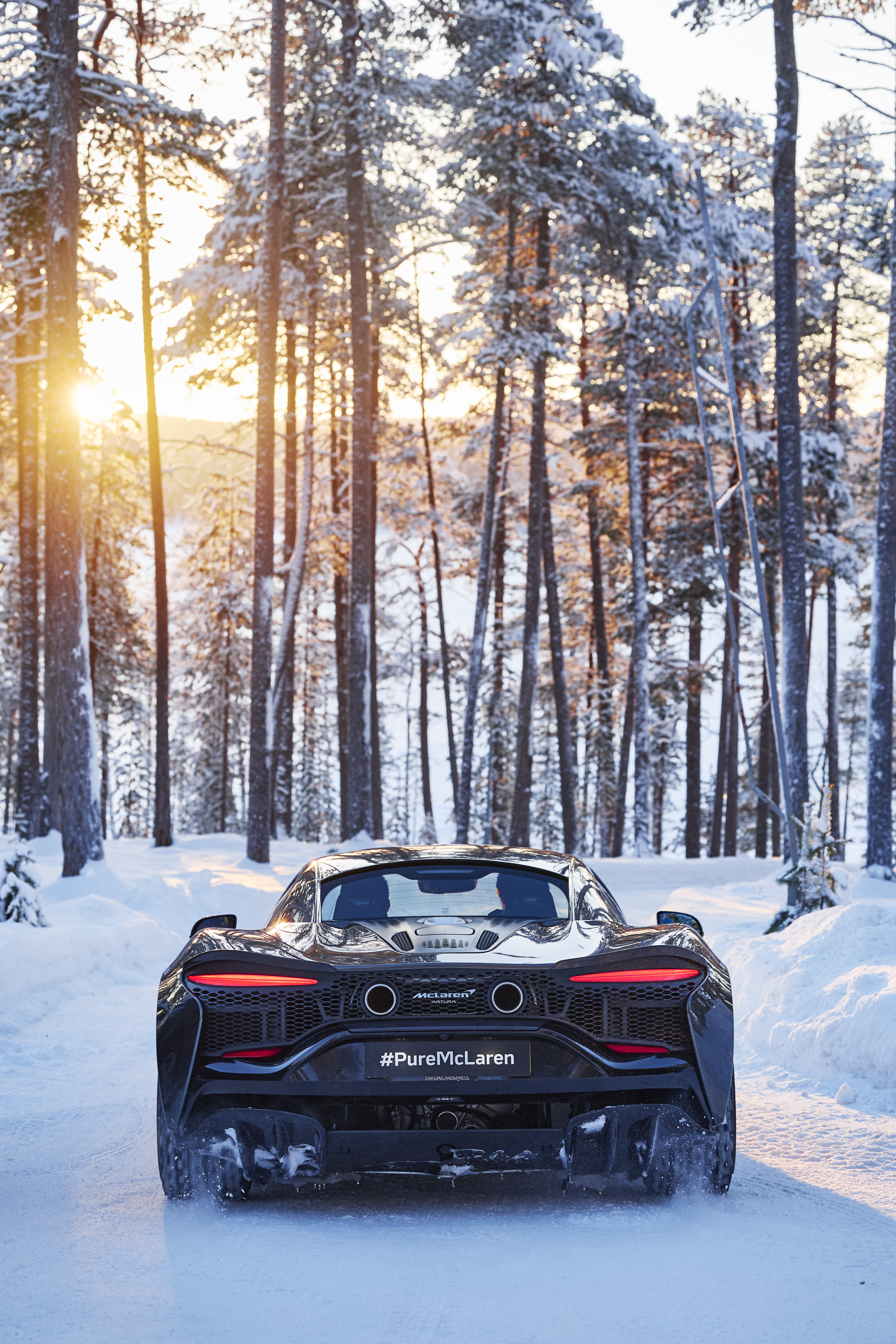 Images of a McLaren Artura going sideways on some ice