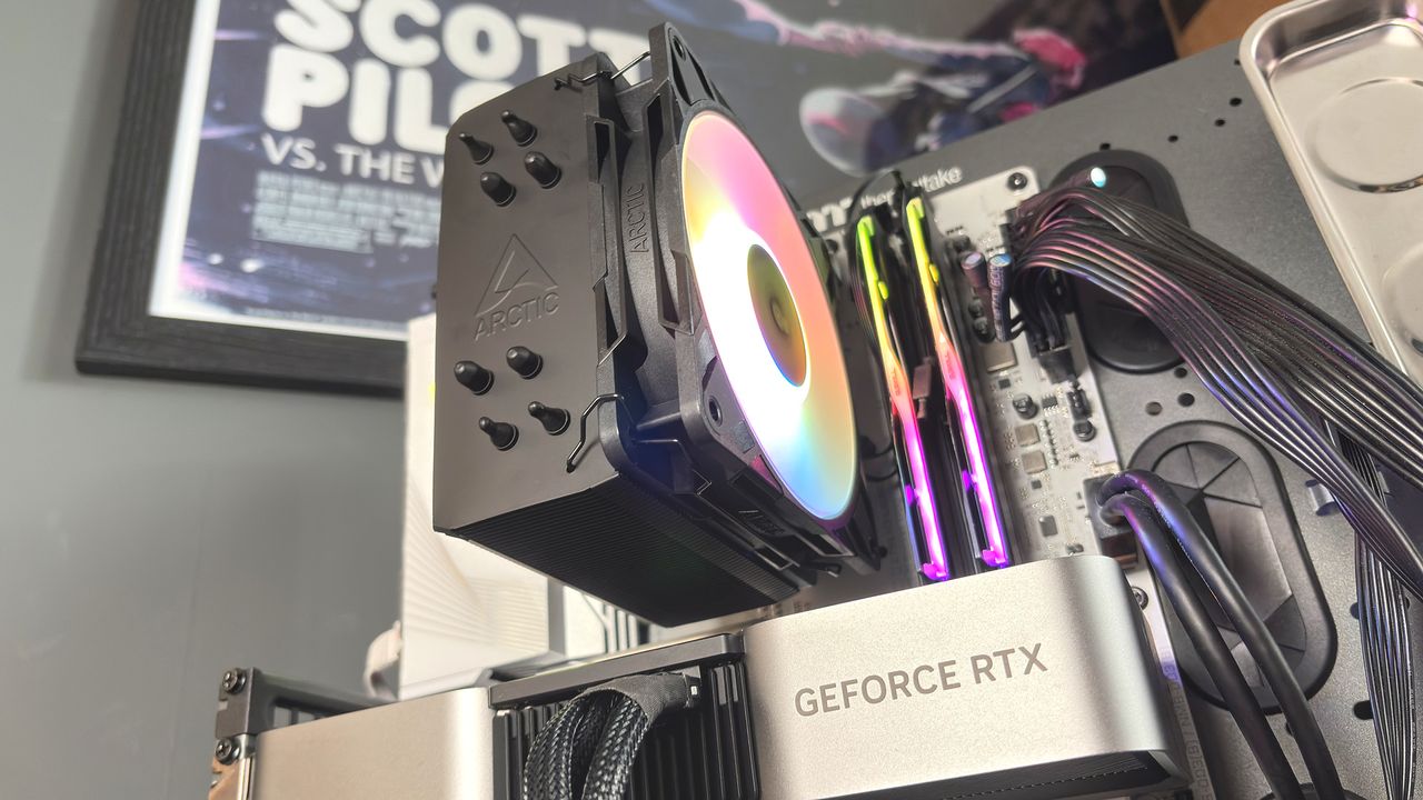 An Arctic Freezer 36-S on a desk and installed in a gaming PC, with the Freezer 36 nearby.