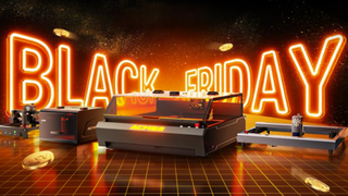 Selection of Acmer laser cutters on a black background with an orange 'Black Friday' sign behind them