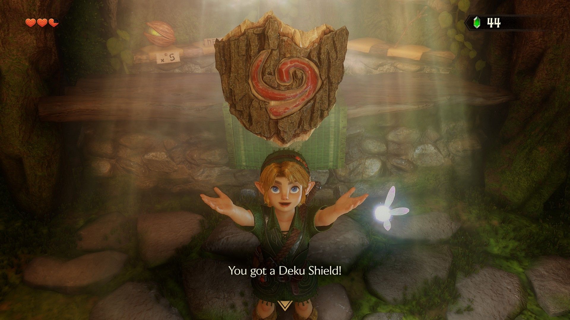 Young Link holds aloft the Deku Shield in The Legend of Zelda: Ocarina of Time remake within a shop