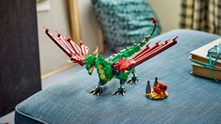 Lego Medieval Dragon set laid out on a fouton