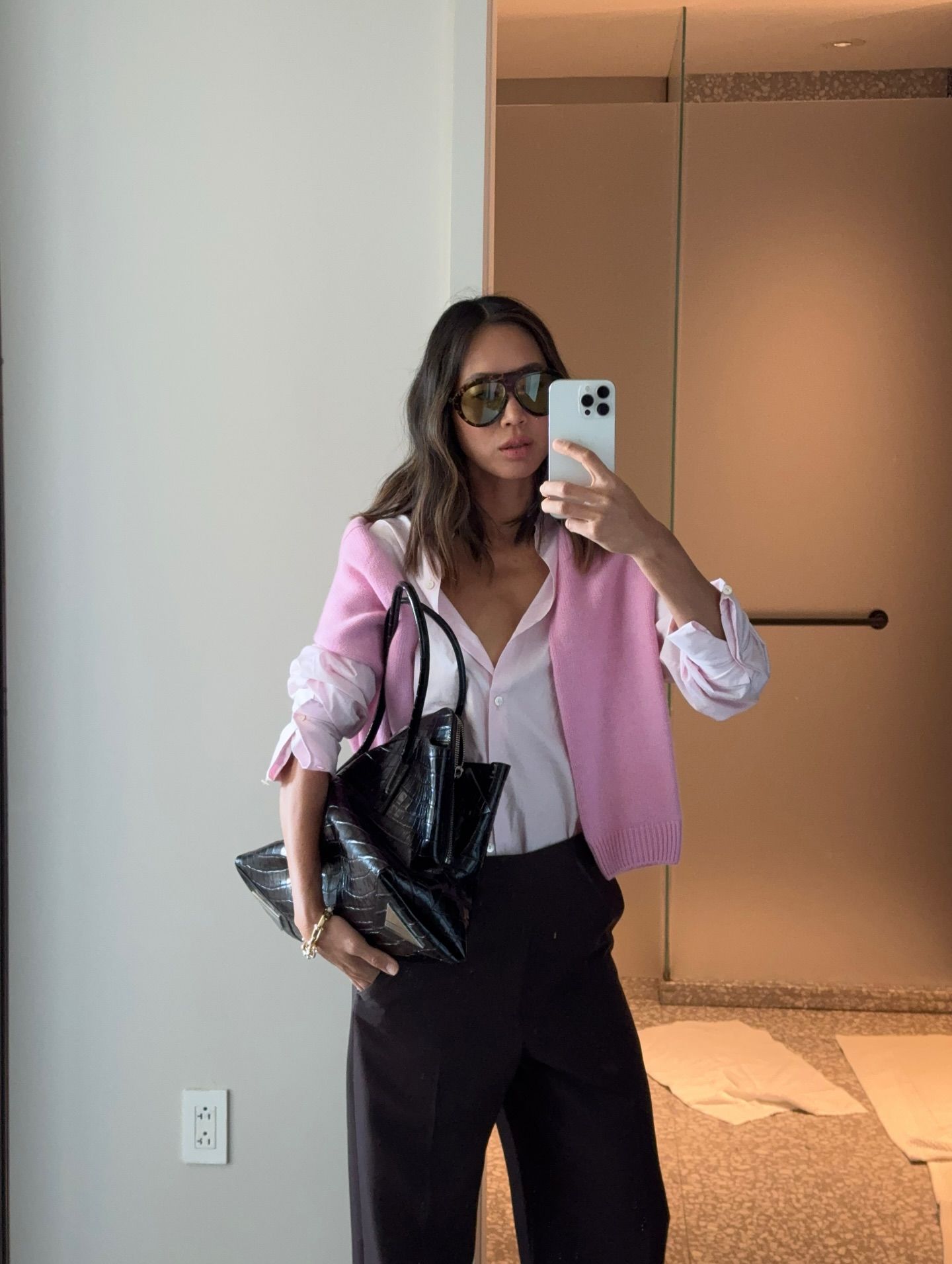 Woman in pale pink shirt and jeans