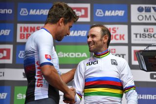 Peter Sagan presents the World Champion's jersey to Alejandro Valverde in 2018