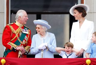 Prince Charles, Prince of Wales, Queen Elizabeth II, Prince Louis of Cambridge and Catherine, Duchess of Cambridge watch a flypast from the balcony of Buckingham Palace during Trooping the Colour on June 2, 2022