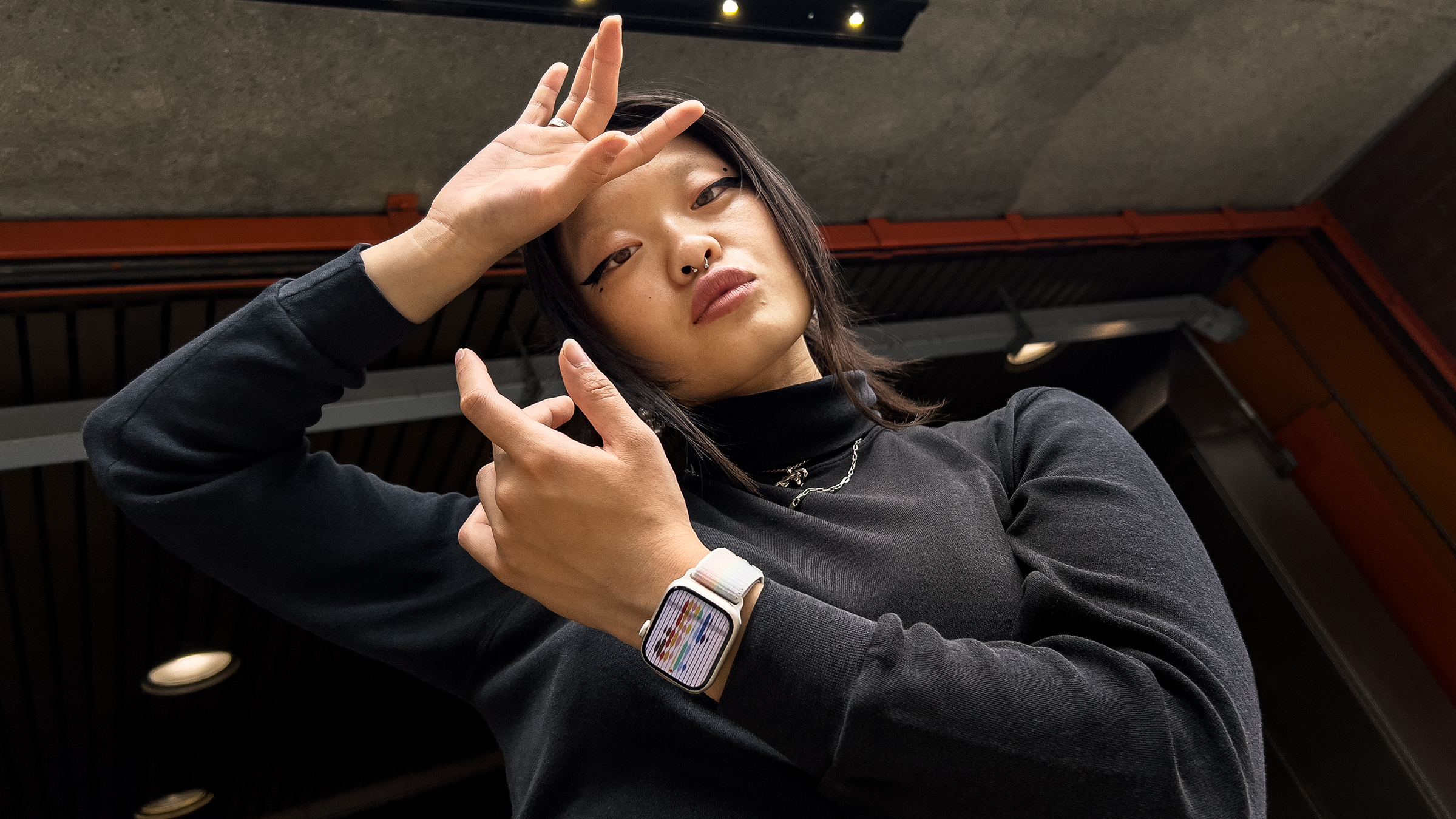 Experimental street dancer Jin Lee Baobei, wearing the new Pride Edition Sport Loop band for Apple Watch