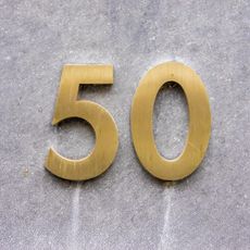 the number 50 in gold numerals on a gray background
