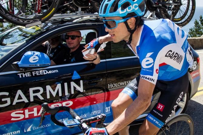 Janier Acevedo (Garmin) goes back to the car for bottles