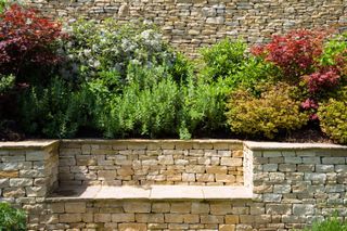 dry stone wall and bench with raised bed