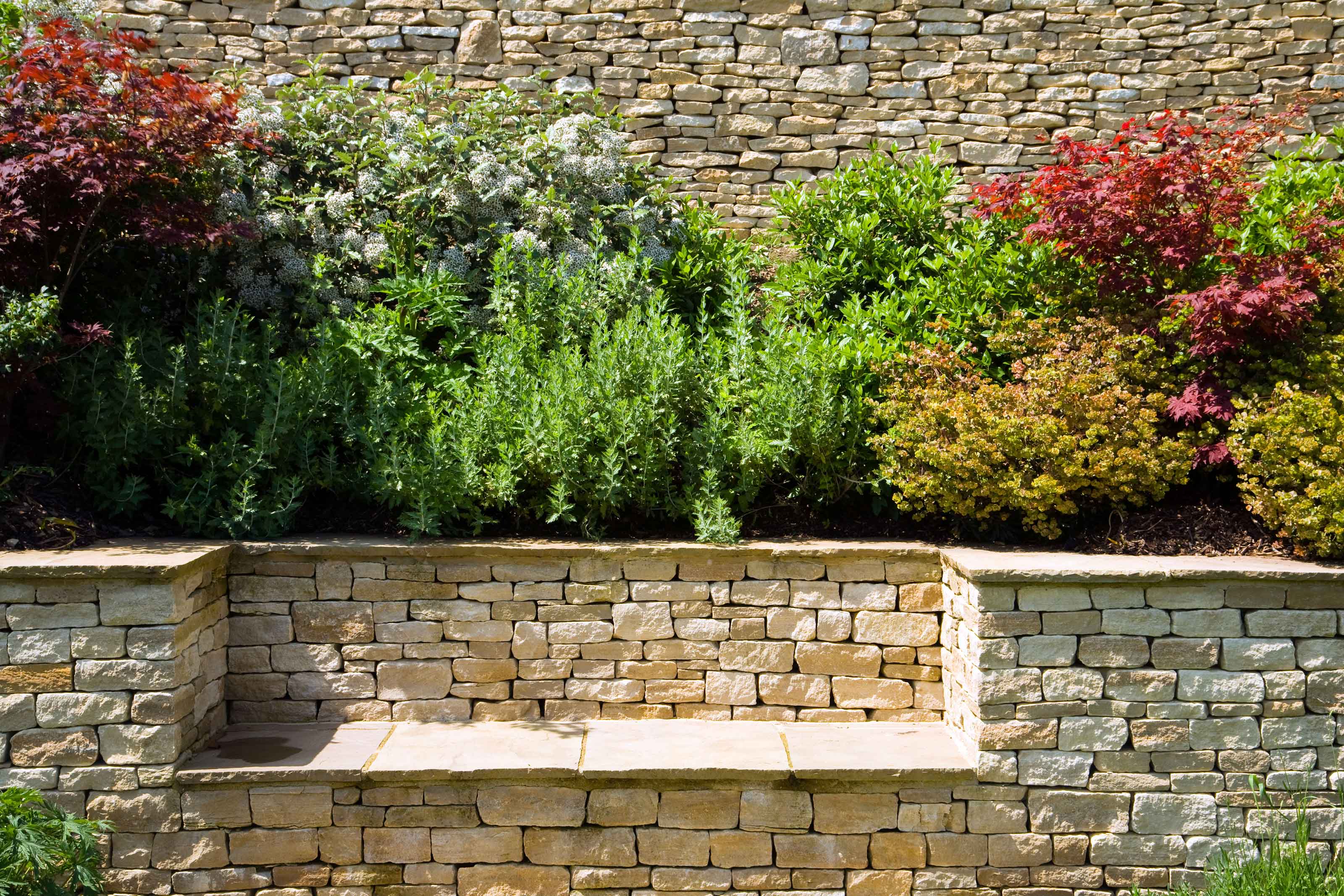 dry stone wall and bench with raised bed