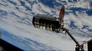 The Northrop Grumman Cygnus NG-18 cargo ship approaches the International Space Station with only one solar panel deployed (the failed one is on the left) on Nov. 9, 2022.