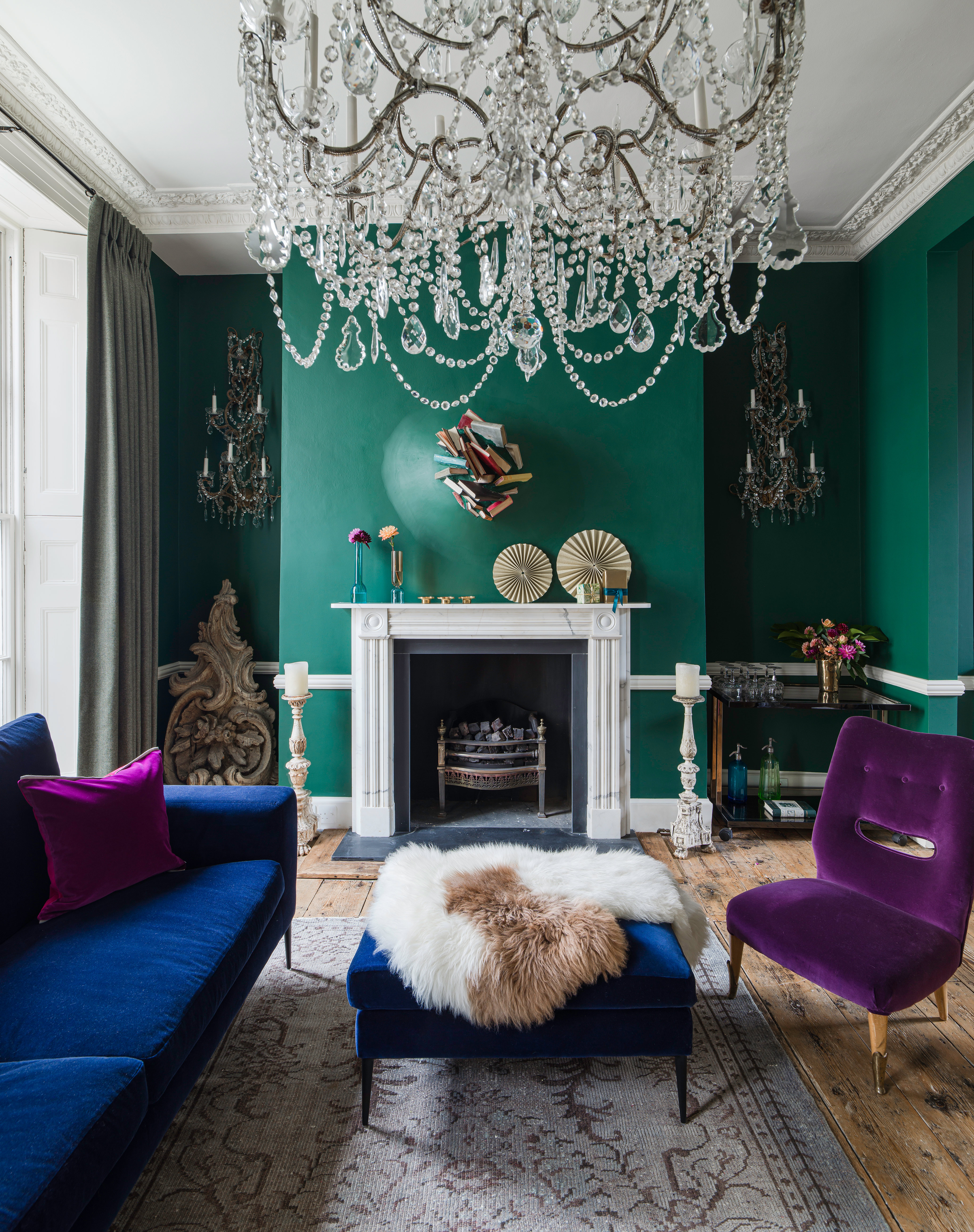 Dark green living room with blue and purple velvet furniture