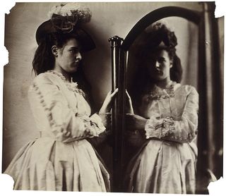 Clementina Maude at 5 Princes Gardens, standing, looking into a large floor mirror; from The Photographic Study Series by Lady Clementina Hawarden