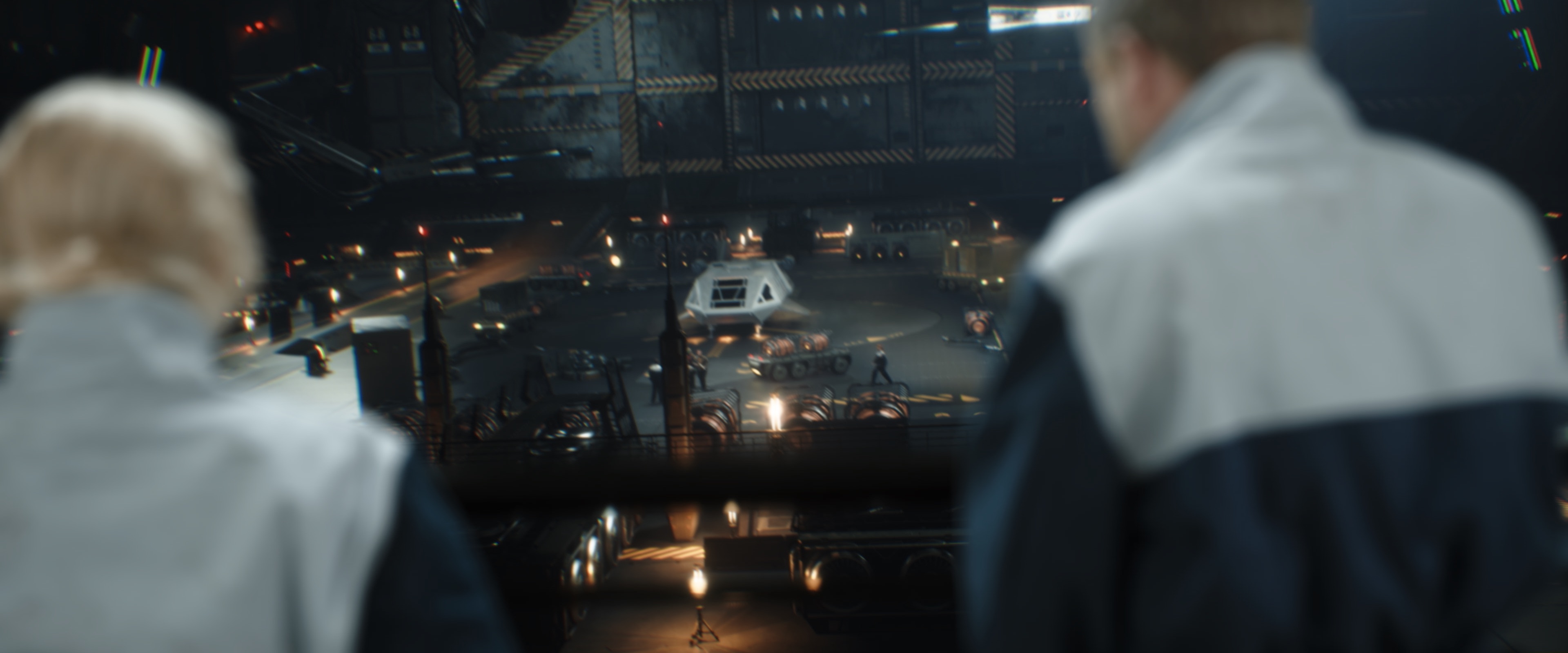 Two people look out over a Star Trek hangar