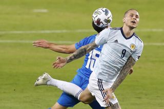 Scotland’s Lyndon Dykes fights for the ball with Israel’s Neta Lavi