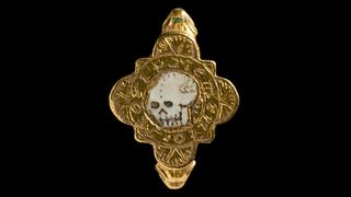 This gold "Memento Mori" ring, dating to the Tudor period, sports an enamel skull.