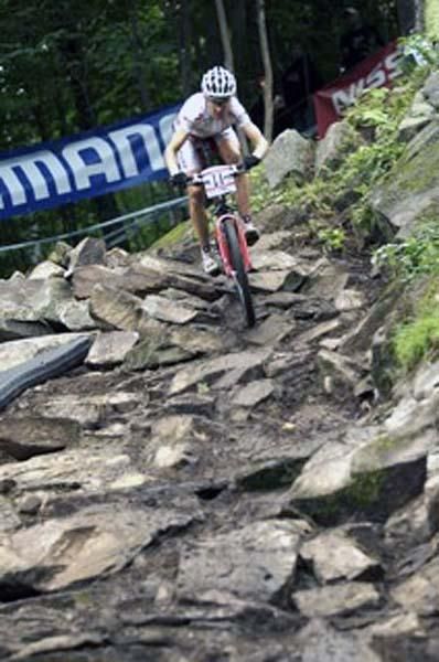 Christoph Sauser rides the rock garden at Mont Sainte Anne.