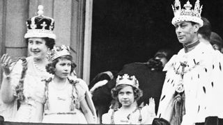 King George VI and Queen Elizabeth with Princess Elizabeth and Princess Margaret Rose, acknowledging the cheers of the crowd from the balcony