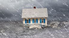 a flood carrying a house
