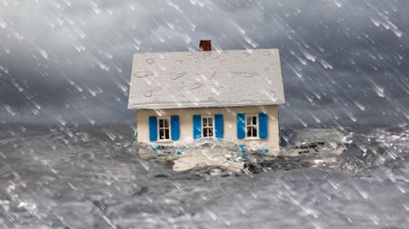 a flood carrying a house