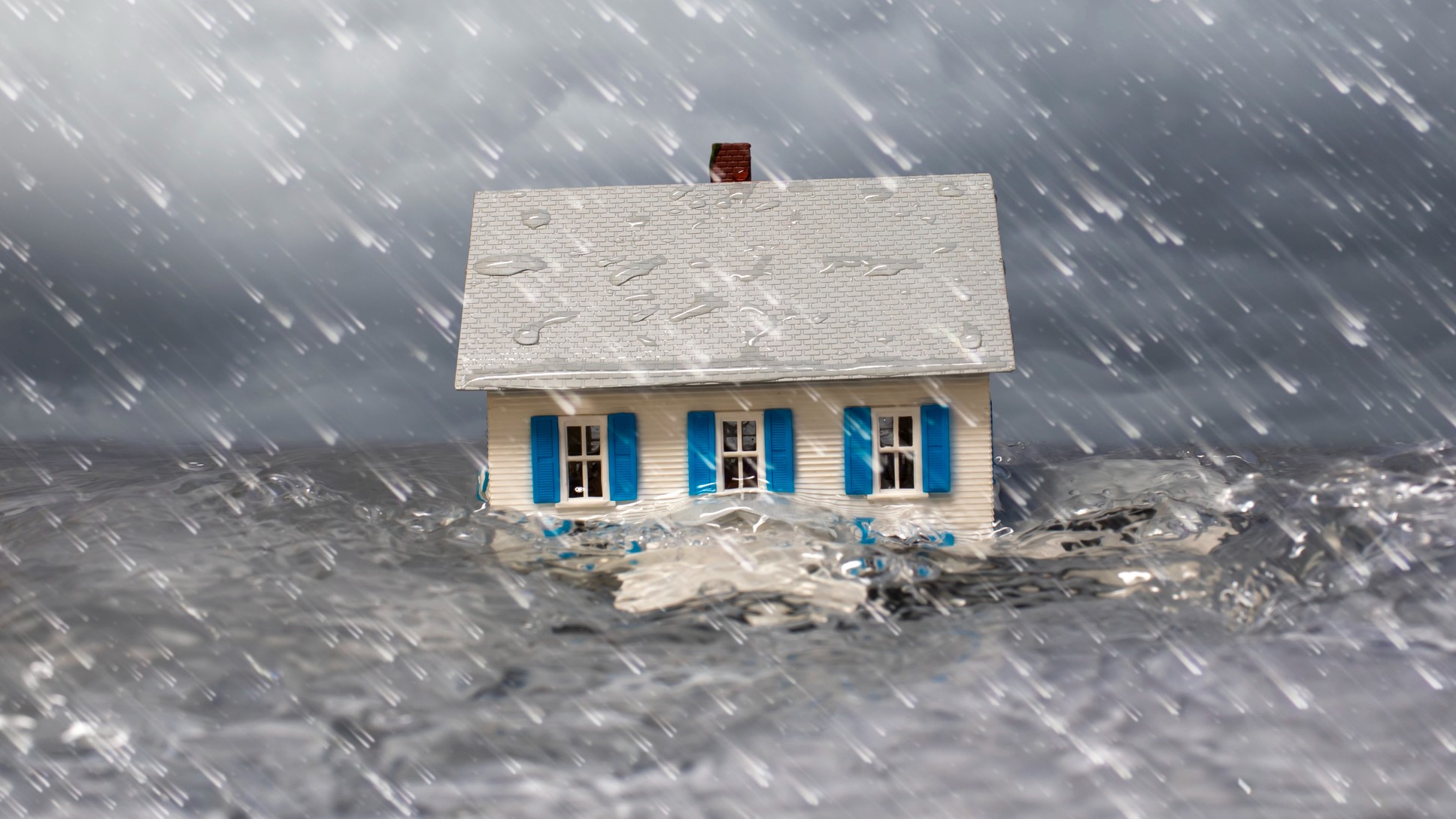 a flood carrying a house