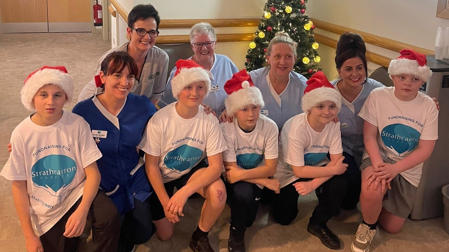The five &#039;Denny Boys&#039; with staff from Strathcarron Hospice