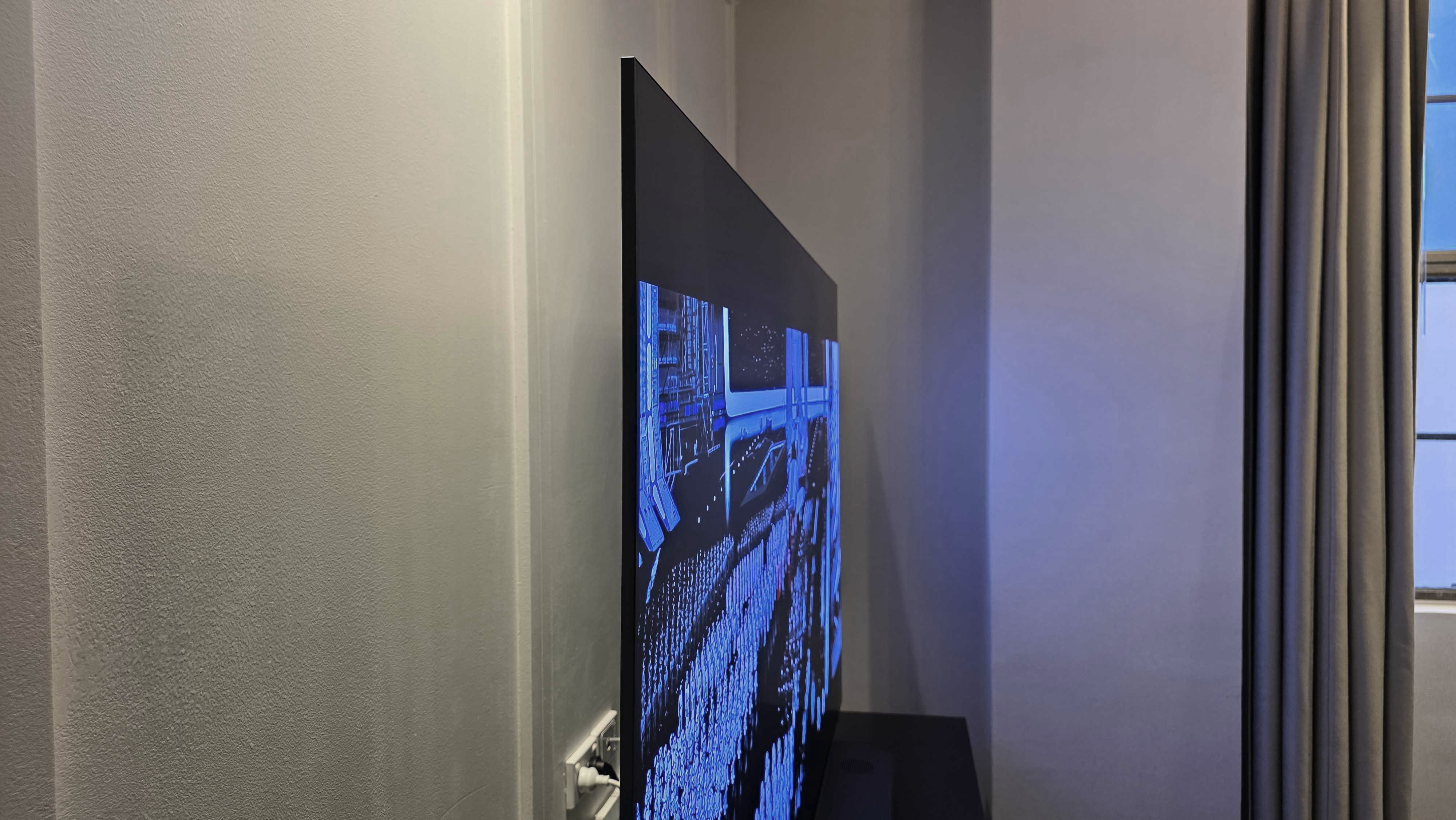 An angled view of Samsung's S95F OLED TV displayed on a bench top