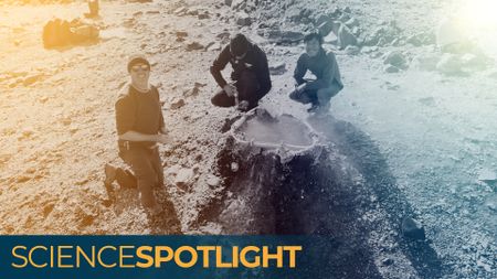 A photo of three men crouched around a hole in the ground emitting helium gas