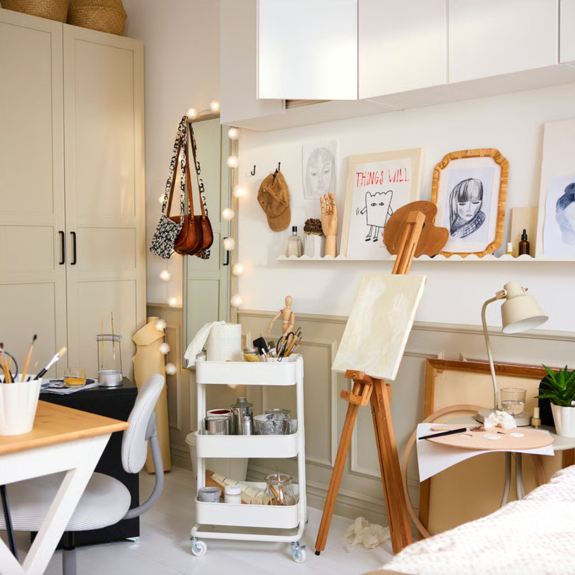 IKEA picture ledge, DAGGKAPRIFOL, in white in neutral crafting room with frames on