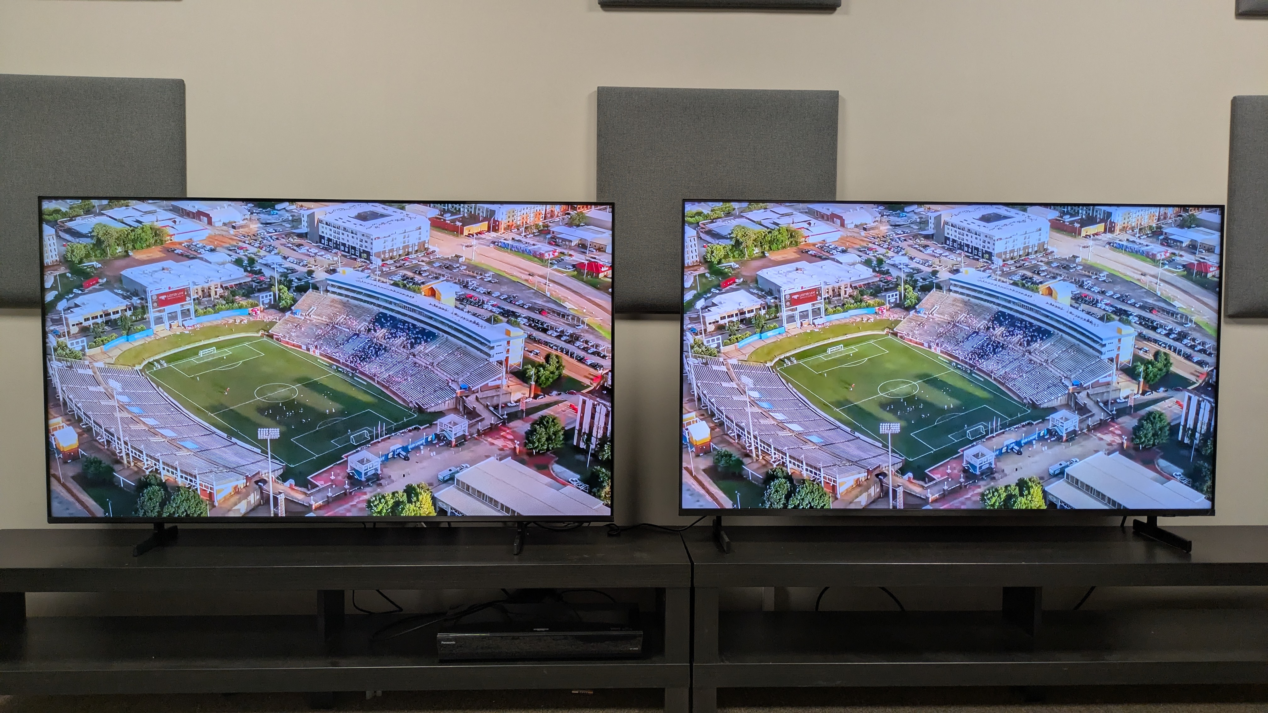 Samsung M80H (left) vs Samsung QN80H (right) showing a football stadium on screen