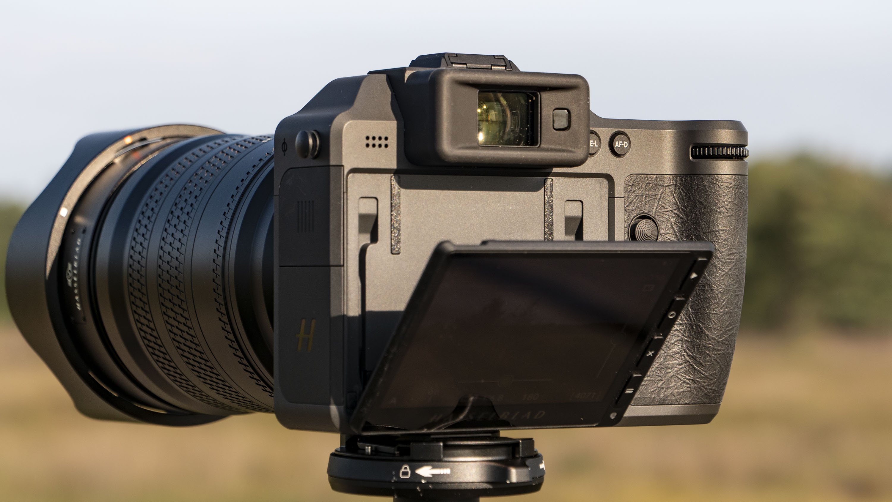 Hasselblad X2D II 100C camera outdoors at first light, with its touchscreen tilted