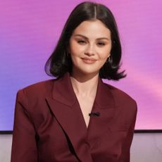 Selena Gomez appeared on the Jennifer Hudson show in a burgundy suit-inspired jumpsuit 