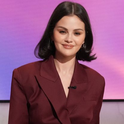 Selena Gomez appeared on the Jennifer Hudson show in a burgundy suit-inspired jumpsuit 