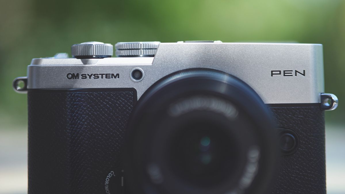Top half of the OM System PEN camera, from the front
