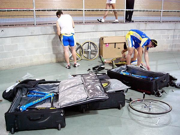 Self-help time sprinters from the Catalunya professional team (Spain) show what many track riders deals with from event-to-event; having to pack their bikes to make the next flight.