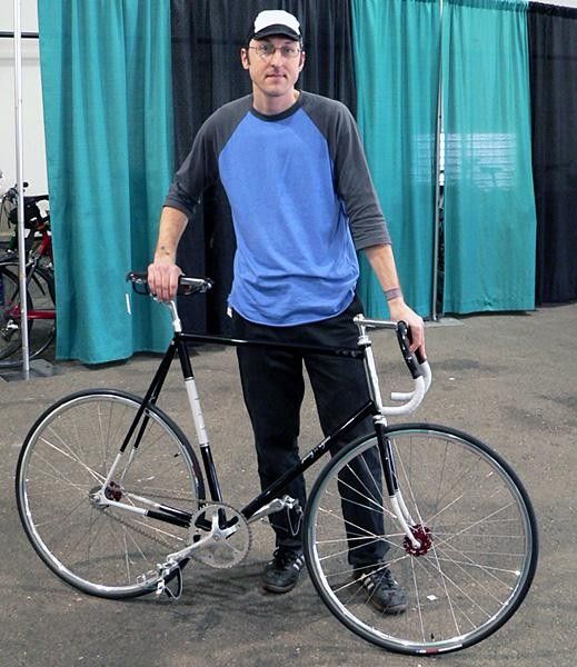 Jon Kendziera of Jonny Cycles holds up his very unique fixed-gear rig. Kendziera is located in Madison, Wisconsin, one of perennial &ldquo;best cities for cycling&rdquo; in the US.