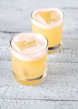 Two whisky sour cocktails