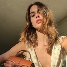 An image of @kaiagerber wearing one of the best Celine bags.