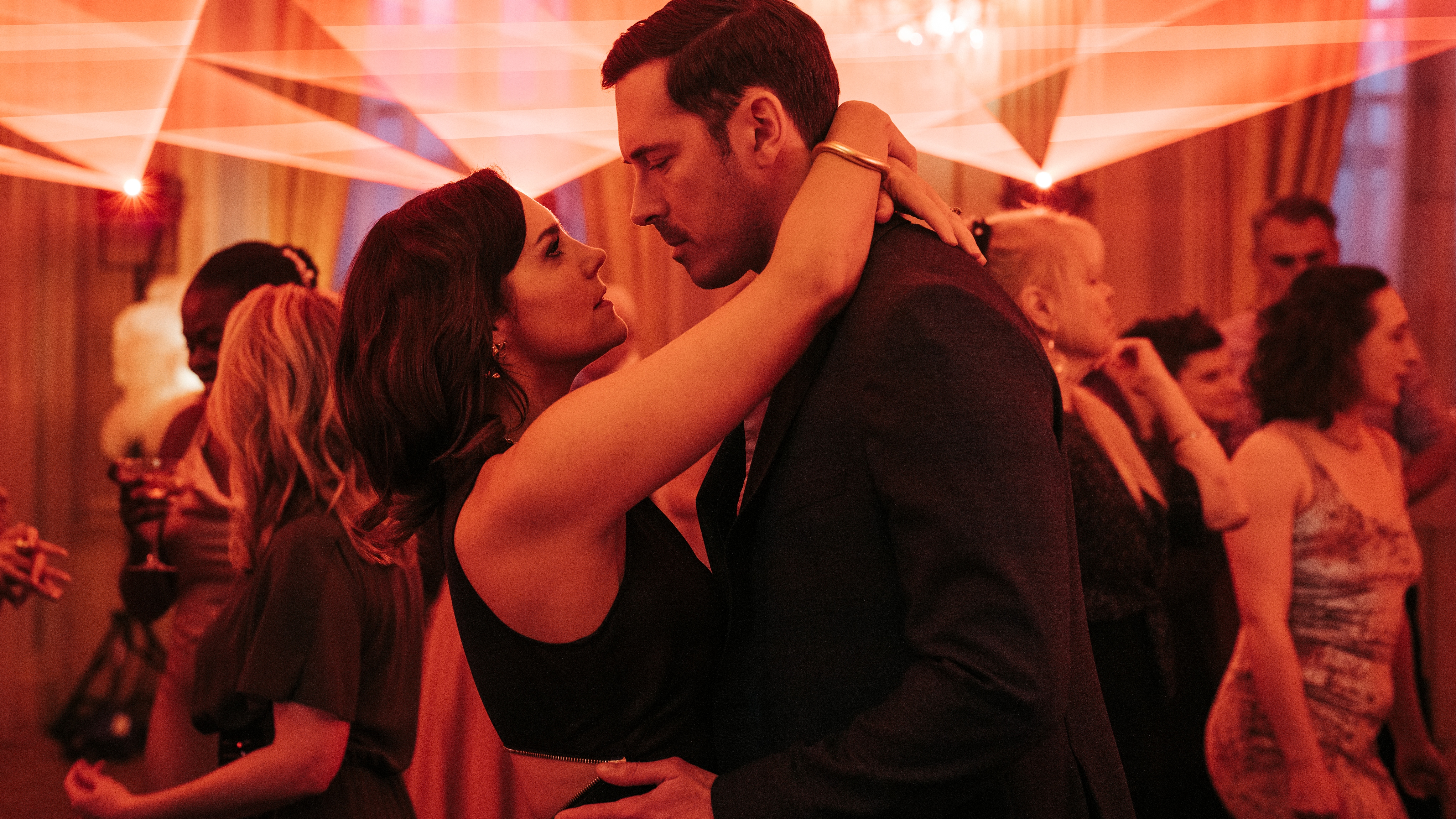 Annabel Scholey as Charlotte and Sam Palladio as Jacob dance together at a ball in The Couple Next Door Season 2