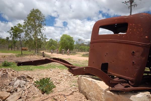 An old, rusty car is a form of outback art.