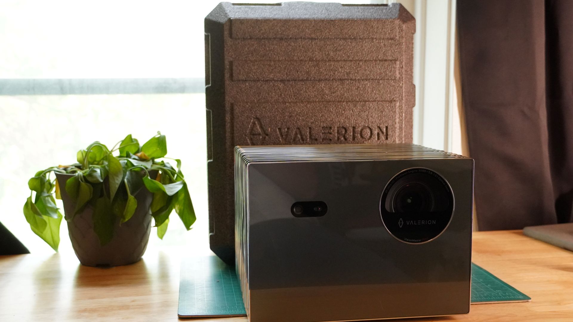 Valerion VisionMaster Pro 2 on table with case and plant