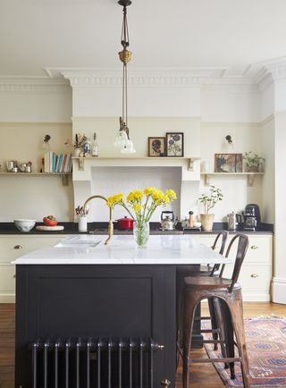 Olive and Barr Shaker kitchen with a mix of dark and light countertops