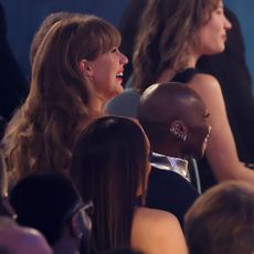 Taylor Swift and Cynthia Erivo sitting together at the 2025 Grammys.