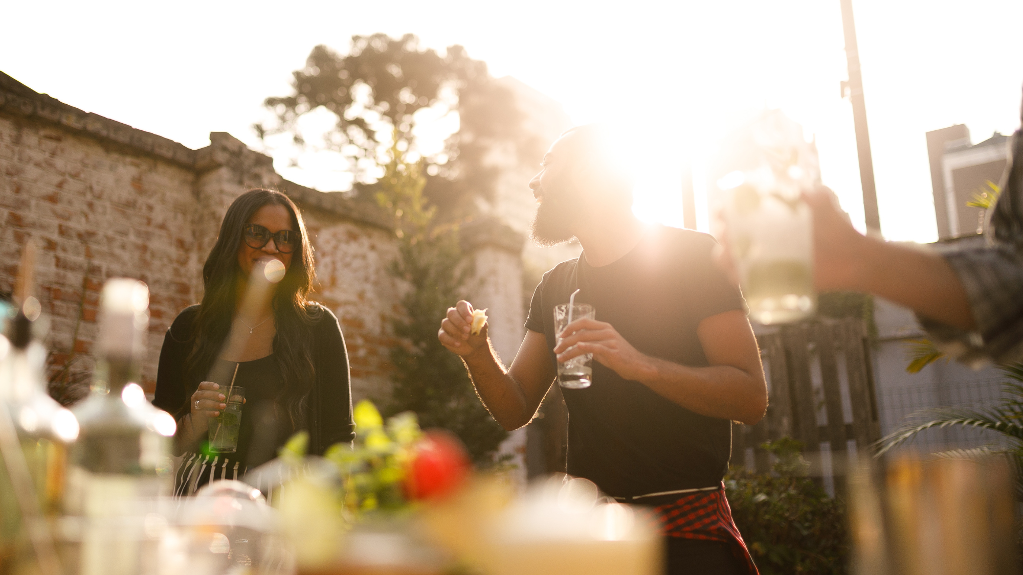 People drinking cocktails outside 