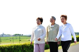 Three older women go walking together