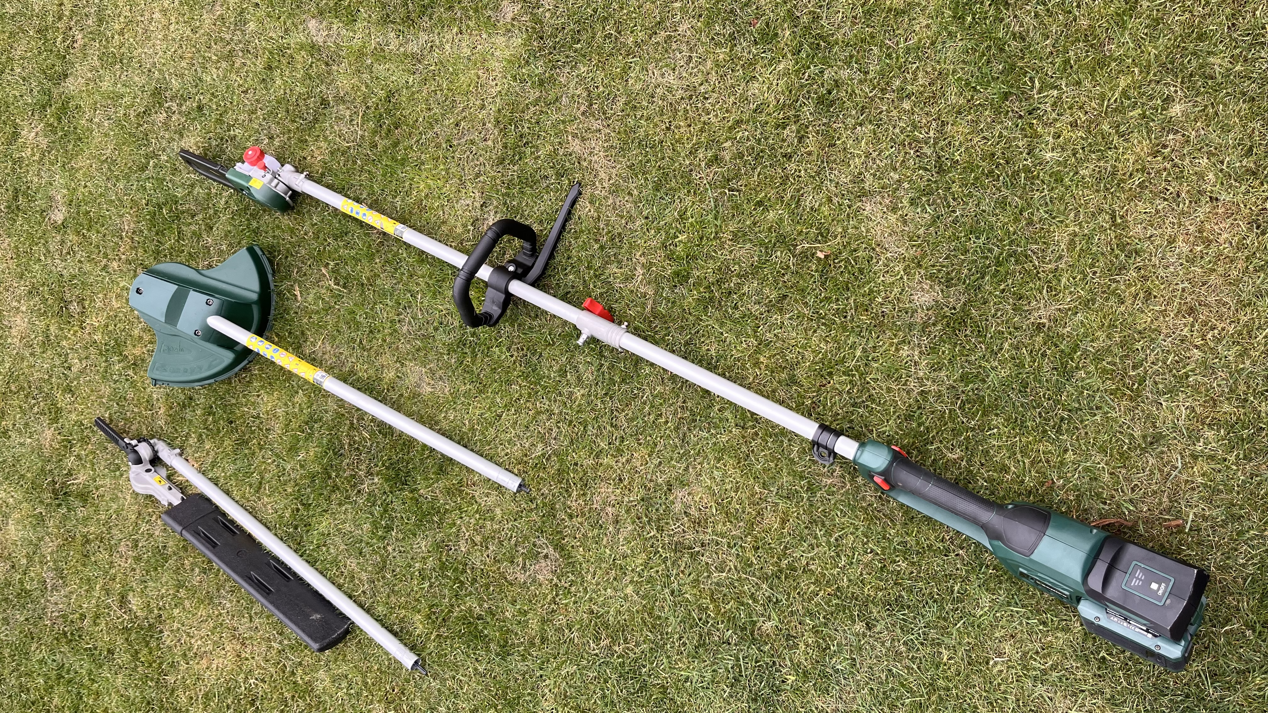 webb multi tool on grass with all attachments