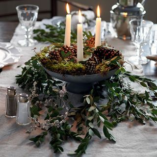 Christmas candle ideas with foliage centrepiece