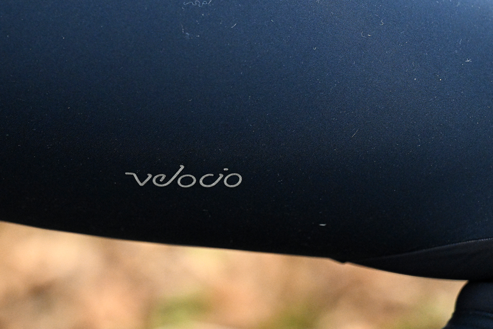 close up of the word Velocio on the right thigh of blue tights