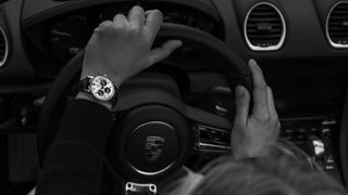 TAG Heuer Carrera Chronograph 60th anniversary on the wrist of someone driving a car